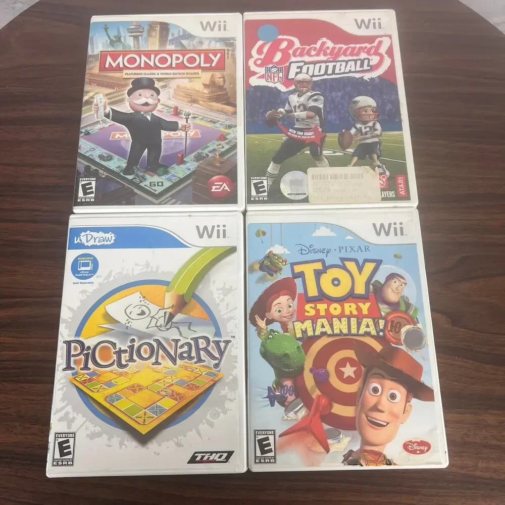Wii Lot of 4 Video Games Monopoly Backyard Football Pictionary Toy Story CIB